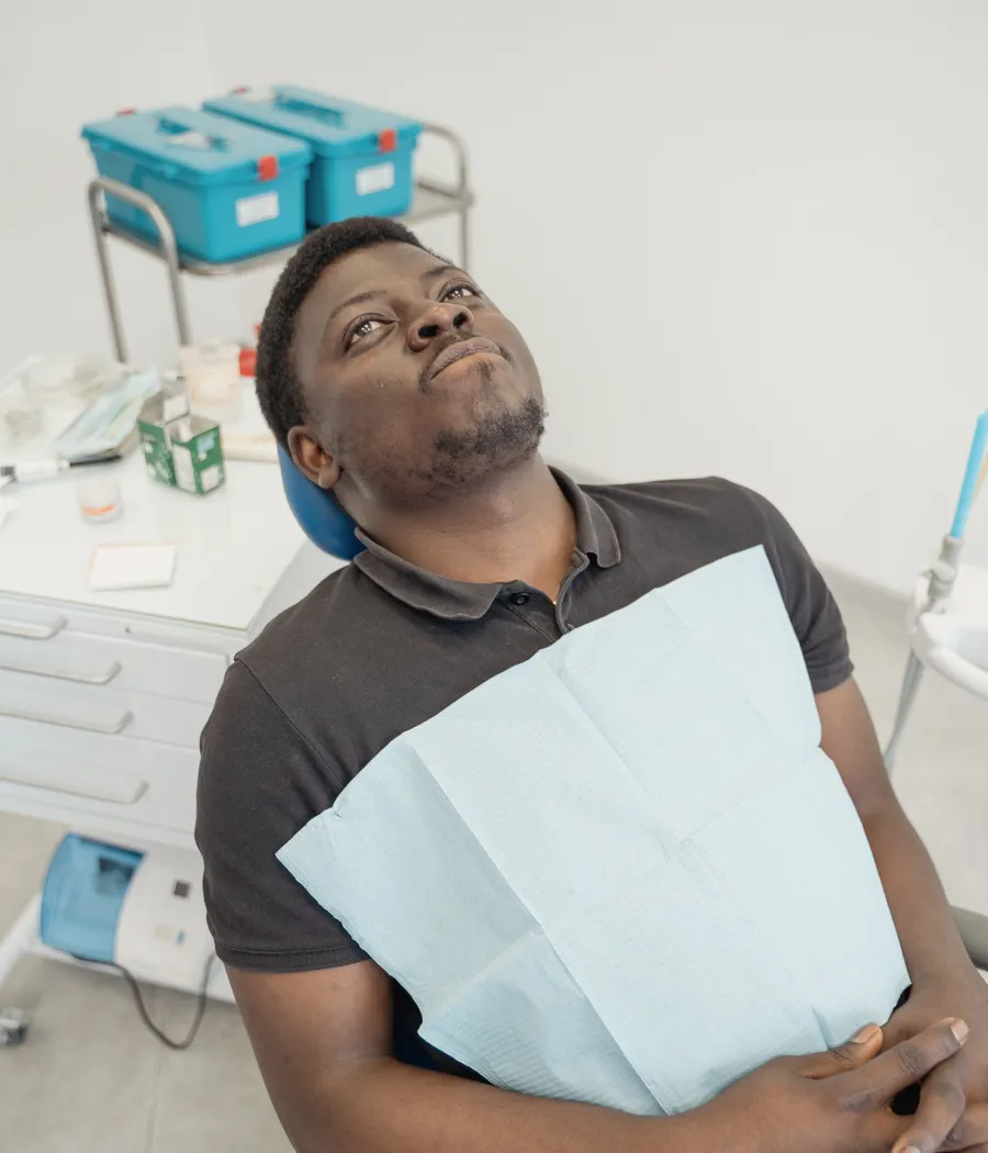 Patient seated in a dental chair ready for care